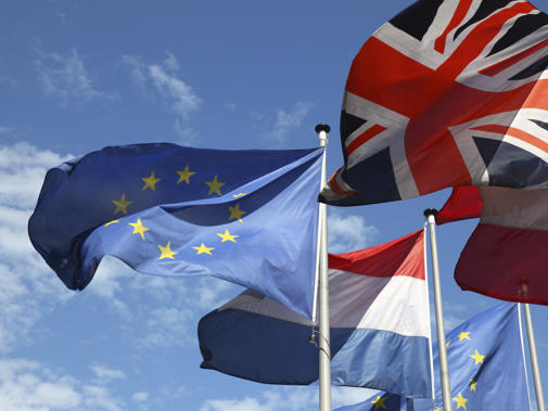 EU, French and UK flags in the wind