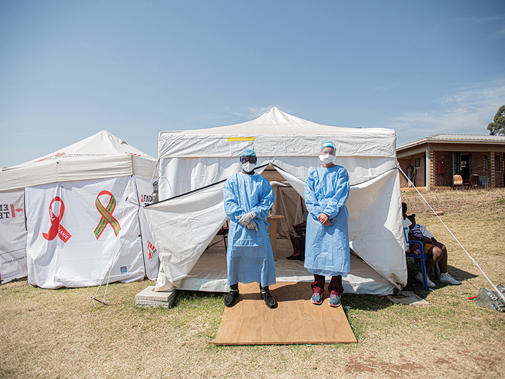 41788 medics outside tent in ppe