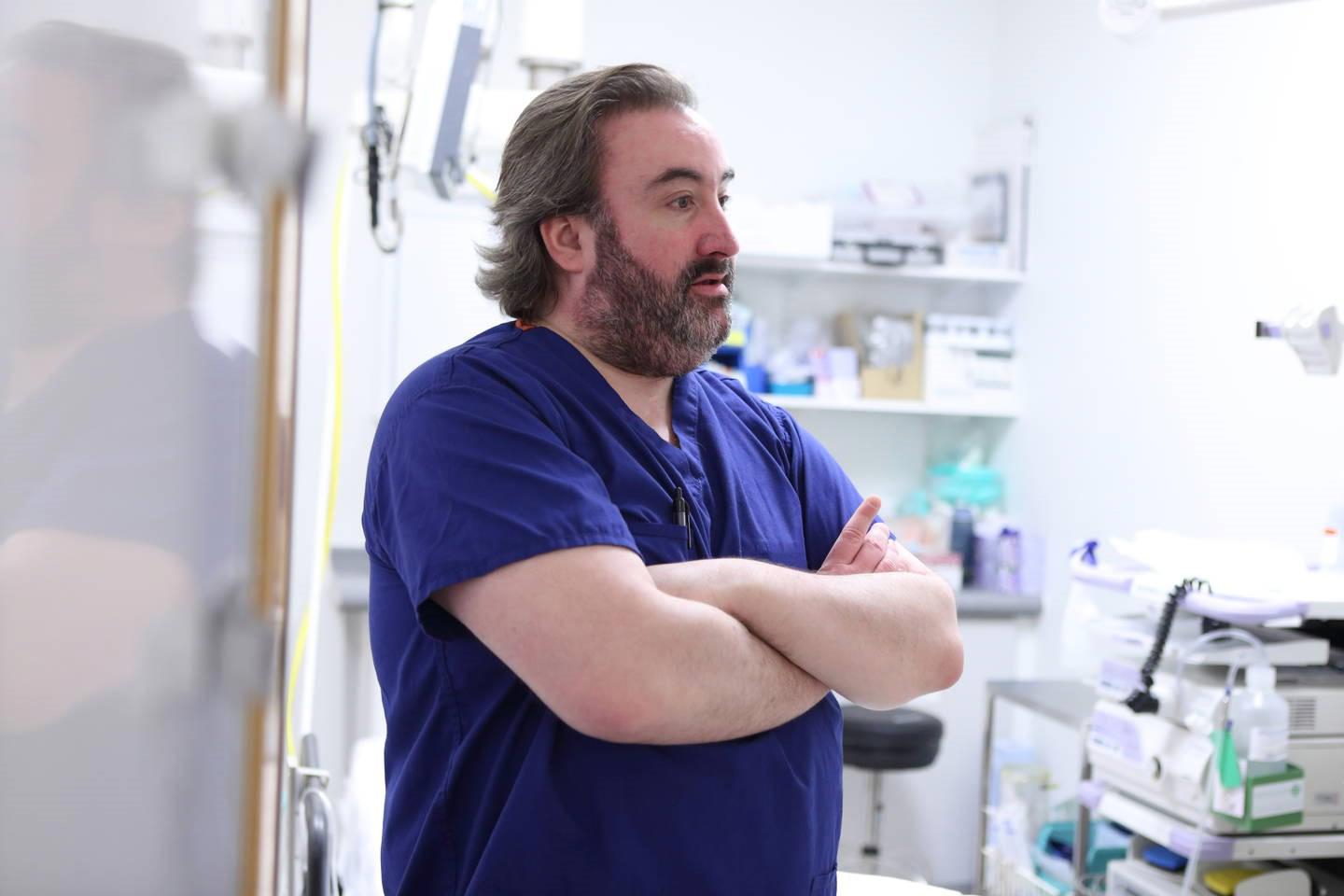 Consultant with arms folded