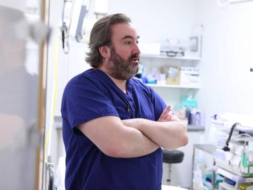Consultant with arms folded