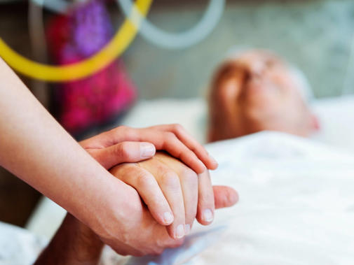 Doctor holding a patient's hand