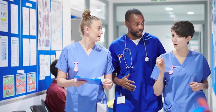 Group of trainee doctors in corridor close up
