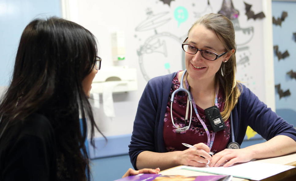 Two doctors talking on ward