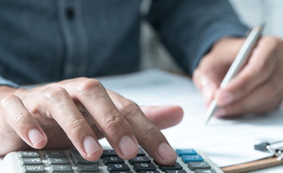 man using a calculator