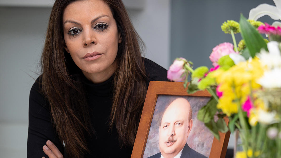 Zehra Zaidi and a photo of her late father Dr Syed Habib Haider Zaidi 