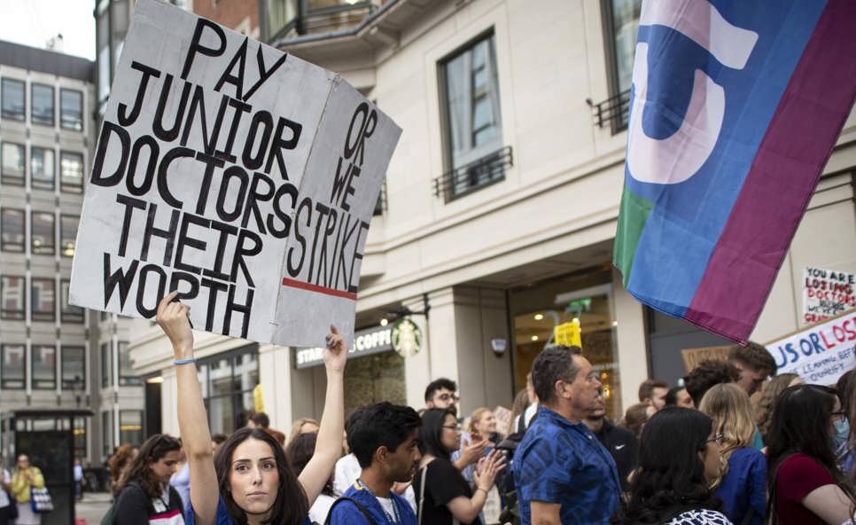 Junior doctor protestor with placard