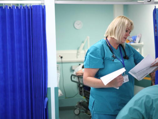 Female consultant with hospital paperwork