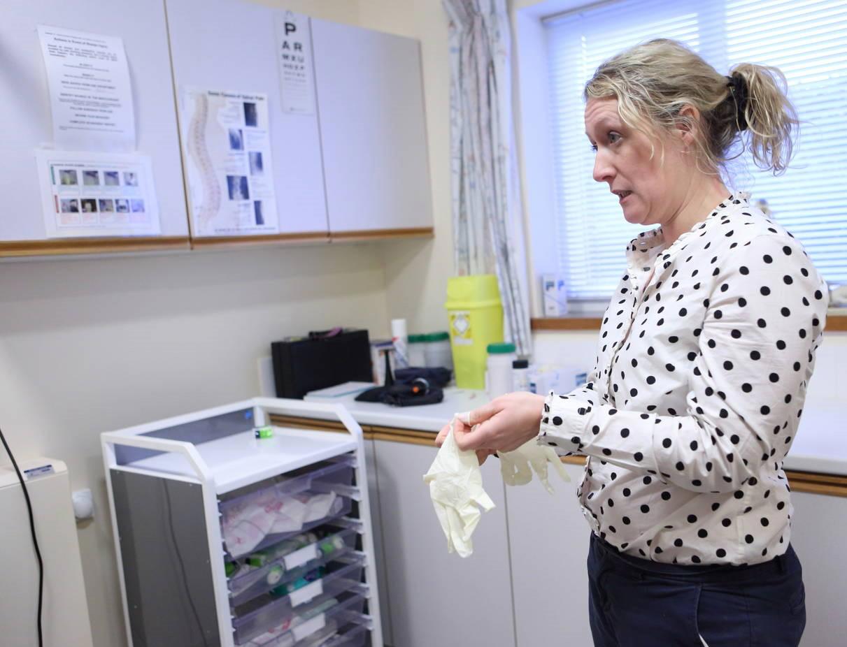 Female GP in surgery