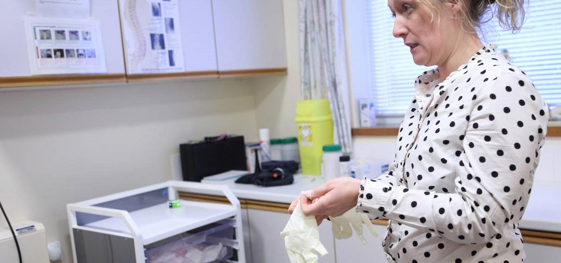 Female GP in surgery