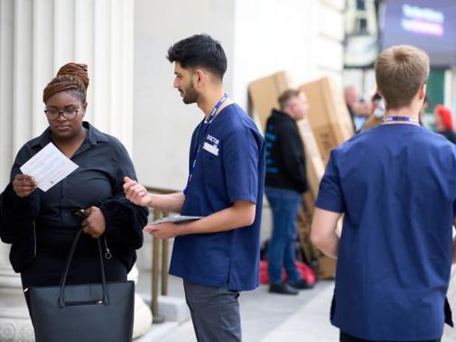 Doctor Talking To Member Of Public about BMA juniors Pay campaign 