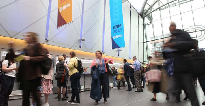 A busy crowd congregates in the reception area of the ACC Liverpool for ARM 2023