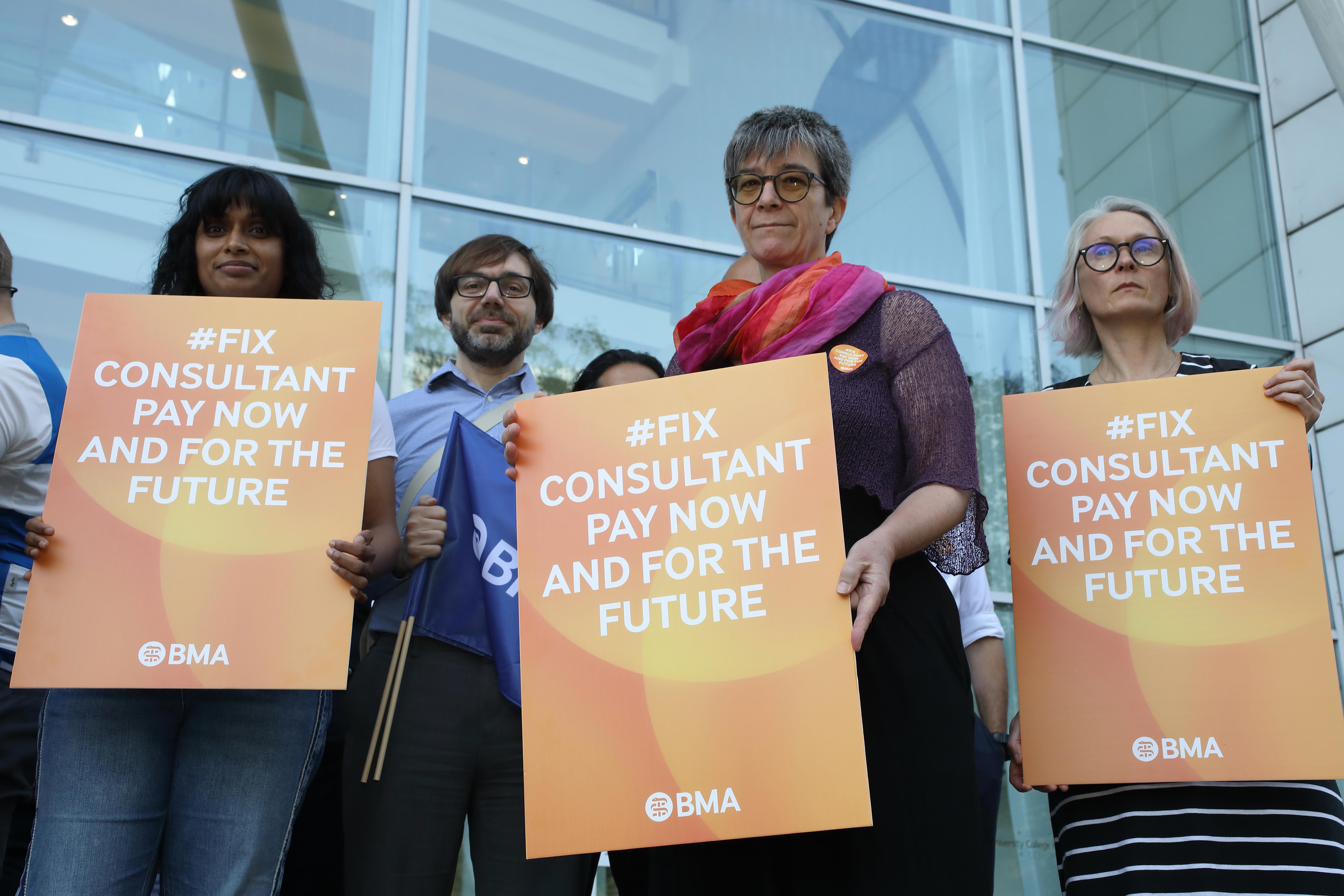 Dr Masters (centre) and Dr Flanagan (second from left): fix pay to fix recruitment