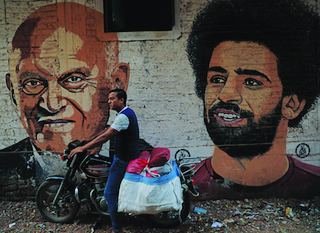 A mural by Hany Gendy depicting Sir Magdi and the Egyptian international football player Mo Salah in Sharqiya Governorate, north of Cairo, in 2020 (credit: Amr Abdallah)